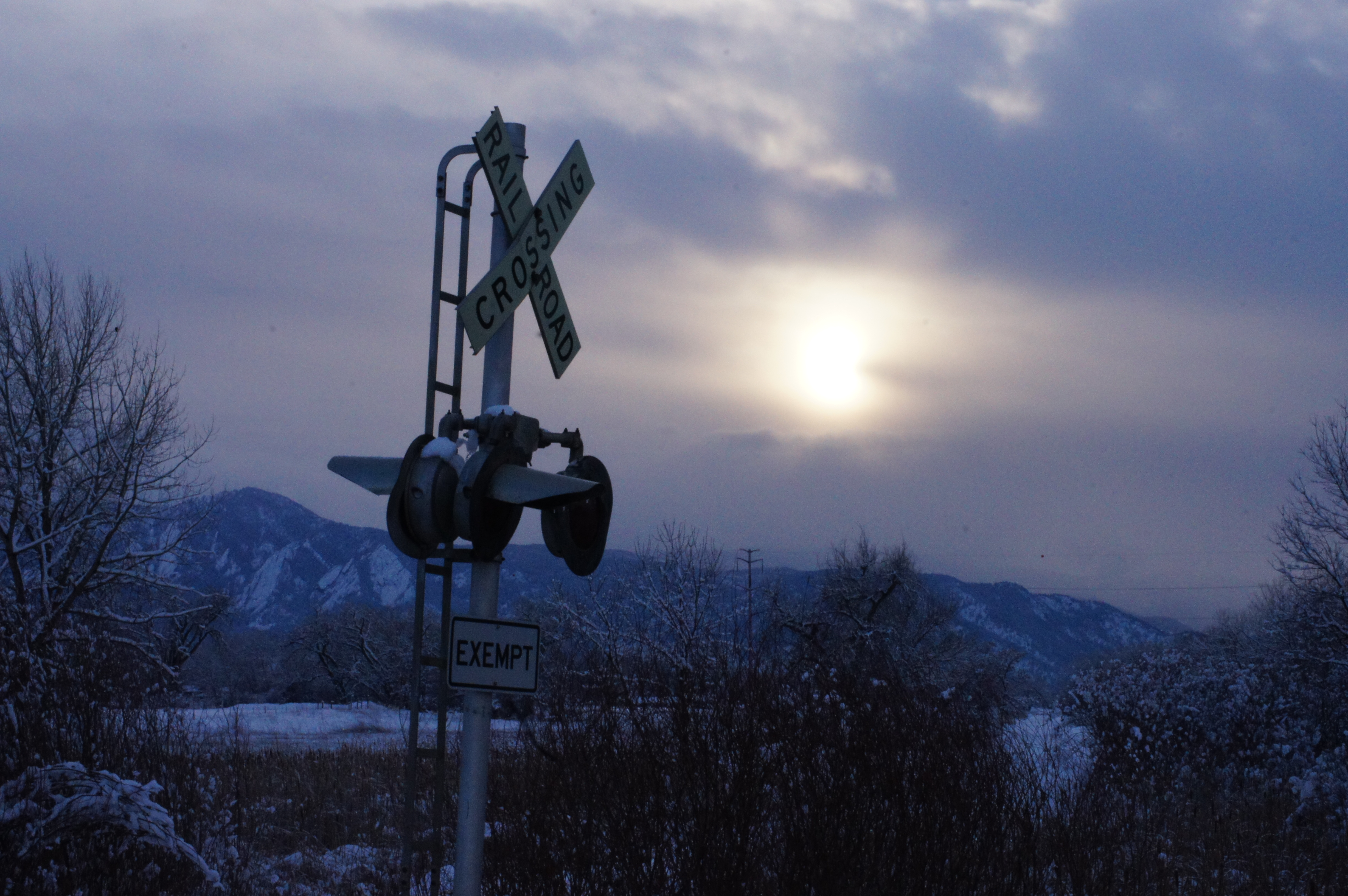 Railroad Crossing with Flatirons in Distance